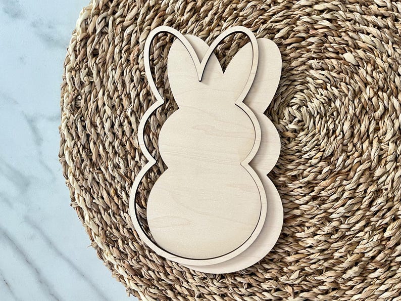 May include: A wooden cutout of a bunny rabbit, perfect for crafting and decorating. The cutout is unfinished and ready to be painted or stained.