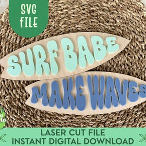 May include: Two wooden surfboard-shaped signs with the phrases "SURF BABE" and "MAKE WAVES" in light blue and blue, respectively. The signs are on a woven background. The image also includes text that says "SVG FILE" and "LASER CUT FILE INSTANT DIGITAL DOWNLOAD".