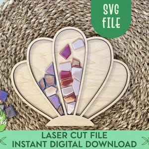 May include: A white ceramic mug with a black handle and the text "But First, Coffee" in a black, bold font. The mug is sitting on a white surface. The mug appears to be empty.