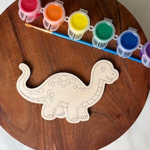 May include: A handmade wooden sign with the text "Welcome to our home" in a handwritten style. The sign is painted white with a dark stained frame. Dimensions are approximately 12 inches wide and 8 inches tall.