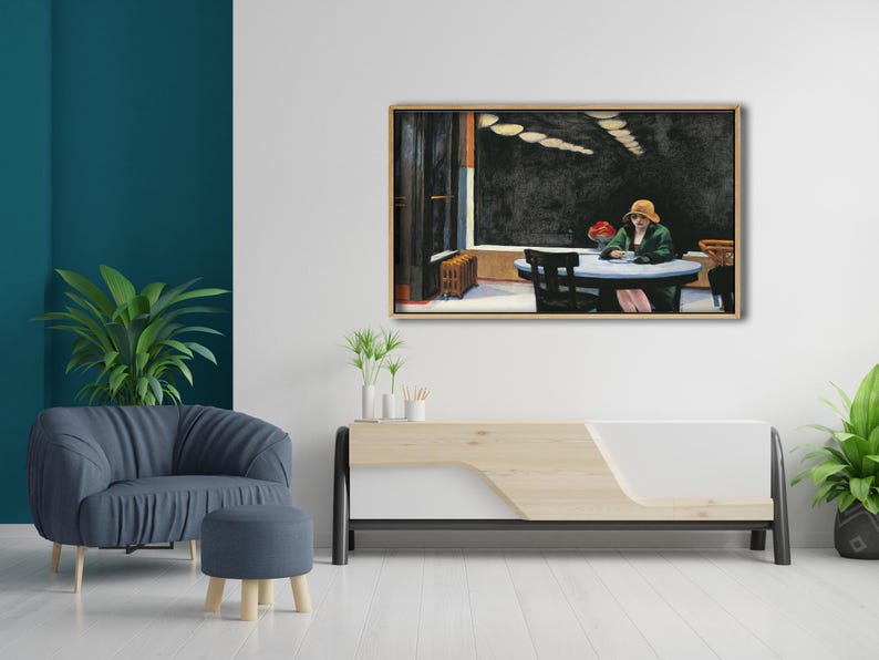 May include: A painting of a woman sitting at a table in a restaurant. The woman is wearing a green jacket and a hat. The restaurant is dimly lit and has a dark wood floor. The painting is framed in a light wood frame.
