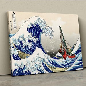 Op de afbeelding: Een digitale kunstprint van een blauwe en witte golf met een rood en groen bootje dat erdoorheen vaart. De golf is geïnspireerd op de beroemde Japanse houtsnede "De Grote Golf voor Kanagawa" van Katsushika Hokusai. Het bootje is een gestileerde versie van een schip uit het videospel "The Legend of Zelda: The Wind Waker".