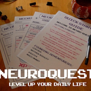 May include: A tabletop scene featuring the "NEUROQUEST" game. The image shows several printed sheets with instructions and character sheets, along with pens, dice, and a pumpkin-shaped mug. The text "NEUROQUEST: LEVEL UP YOUR DAILY LIFE" is displayed.