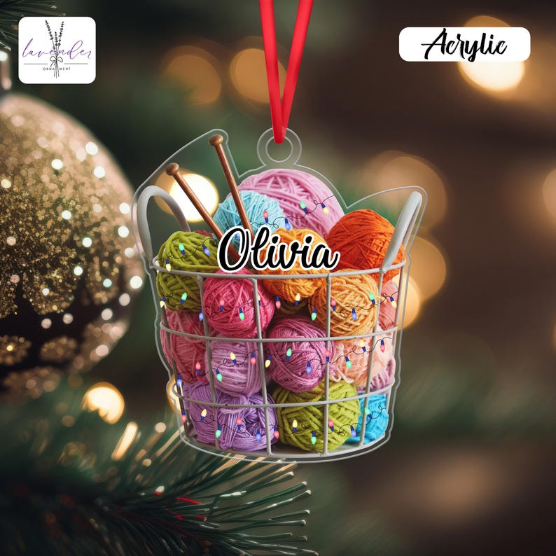 a Christmas ornament shaped like a wire basket filled with colorful balls of yarn, hanging on a tree branch.