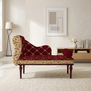 May include: A chaise lounge with a burgundy velvet seat and backrest, featuring a gold diamond pattern. The armrest and edges are trimmed with a cream-colored fabric with a floral design. The legs are dark brown.