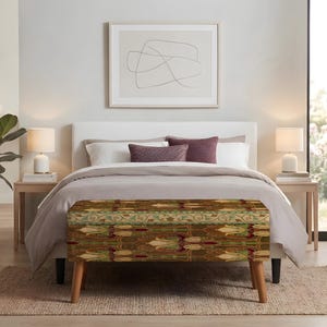 May include: A rectangular upholstered bench featuring a repeating floral pattern in shades of brown, green, and cream. The bench is supported by four tapered wooden legs and is positioned at the foot of a bed in a bedroom setting.