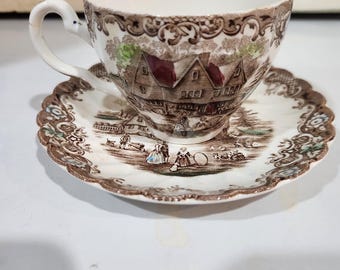 Taza de té con voladizo colonial del Heritage Hall