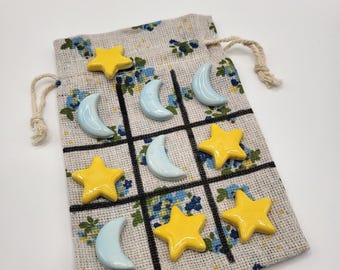 Ceramic Tic-tac-toe to-go bag. Blue Moons and Yellow Stars, ceramic pieces just under 1in. *NOT FOR KIDS under 3yrs.