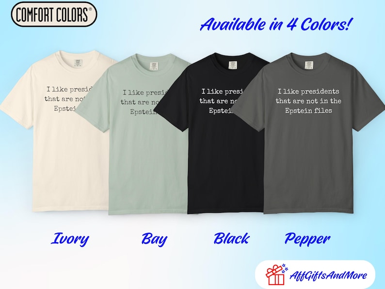 K&ouml;nnte beinhalten: Vier Comfort Colors T-Shirts in den Farben Ivory, Bay, Black und Pepper. Jedes Shirt tr&auml;gt den Text "Ich mag Pr&auml;sidenten, die nicht in den Epstein-Akten stehen." Die Shirts sind in vier Farben erh&auml;ltlich.