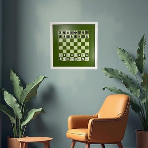 May include: A framed chess board art piece with a green and white checkered design. The chess pieces are white and black. The artwork is displayed on a teal wall, with a brown leather armchair and a small wooden table in front.