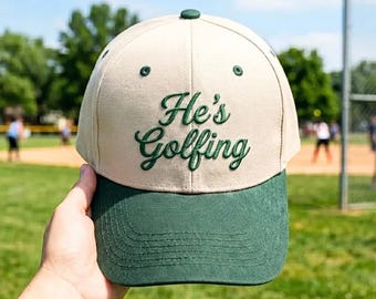 Embroidered He's Golfing Hat, Funny Golf Gift for Men, Retro Baseball, Cap Forest Green Cream Dad Hat, Unique Golfing Apparel for Husband