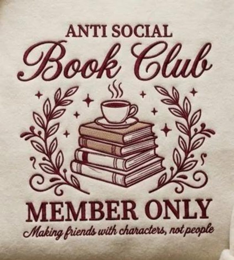 May include: Cream-coloured graphic with burgundy text reading "ANTI SOCIAL Book Club". A stack of books is topped with a coffee cup, surrounded by leaves and stars. The text "MEMBER ONLY" and "Making friends with characters, not people" are also included.