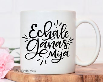 Echale Ganas Mija, Spanish lettering featuring these Latinx words of motivation on an 11oz coffee mug