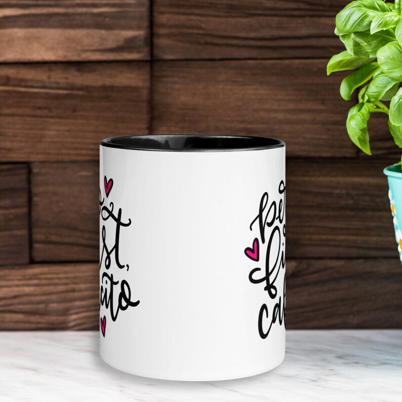 May include: White ceramic mug with a black rim. The mug has a pink heart and black text that reads "Best Friends, Cake & Coffee" on one side and "Best Friends, Cake & Coffee" on the other side.