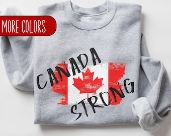 May include: Gray sweatshirt with a distressed Canadian flag and the text "CANADA STRONG" printed on it.
