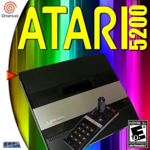 May include: Atari 5200 video game console with a joystick controller. The console is black and silver, with the Atari 5200 logo. The joystick has a numeric keypad. The background is a rainbow gradient.