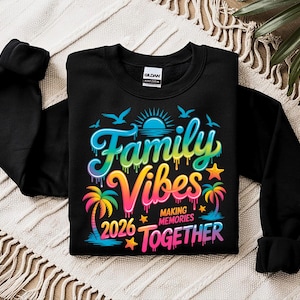 May include: Black sweatshirt with the words "Family Vibes 2026 Making Memories Together" in a colorful, tropical design. The graphic includes palm trees, birds, a sun, and stars.