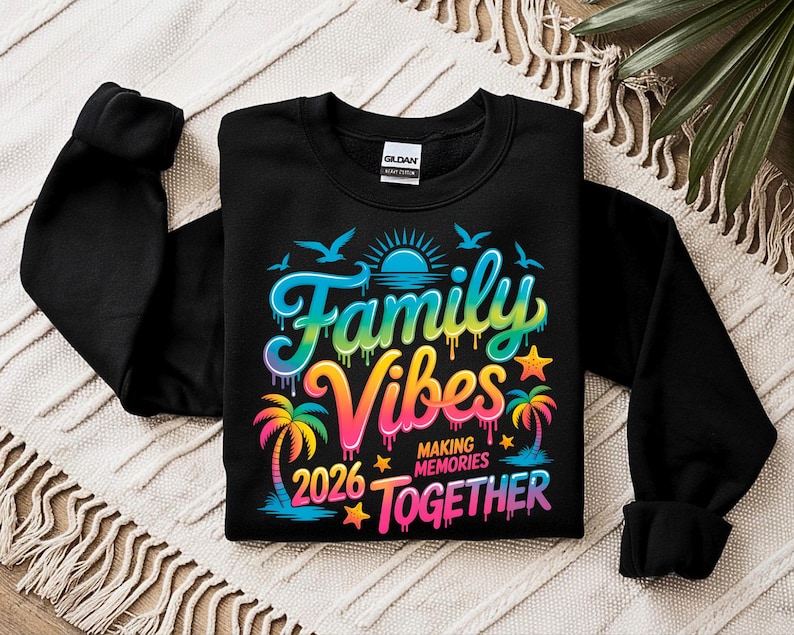 May include: Black sweatshirt with the words "Family Vibes 2026 Making Memories Together" in a colorful, tropical design. The graphic includes palm trees, birds, a sun, and stars.