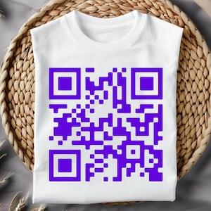 May include: White t-shirt with a purple QR code printed on the front.