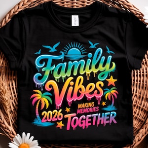 May include: Black t-shirt with a colorful graphic that reads "Family Vibes" with the year "2026" and the words "Making Memories Together." The design includes palm trees, stars, birds, and a sun.