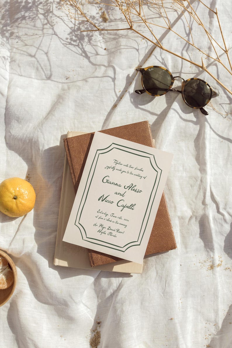 May include: A wedding invitation with a white background and green text. The invitation reads "Together with their families joyfully invite you to the wedding of Gianna Alesso and Nicco Capelli Saturday, June 18th, 2023 at five o'clock in the evening La Playa Beach Resort Naples, Florida"