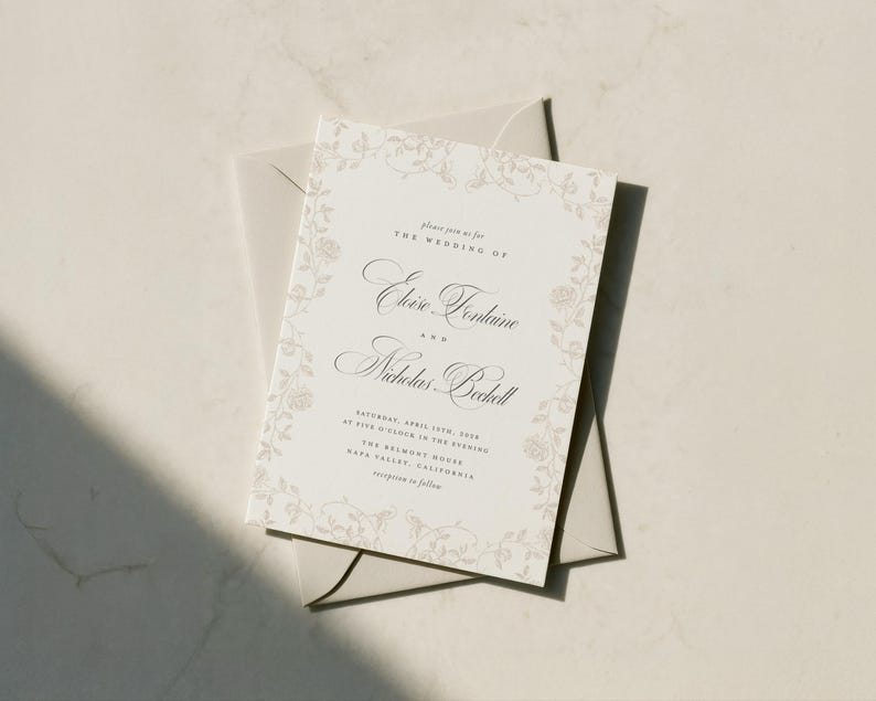 May include: A rectangular wedding invitation card with a cream background and a delicate beige floral border. The text reads: Please join us for THE WEDDING OF Eloise Fontaine AND Nicholas Bechell SATURDAY, APRIL 13TH, 2024 AT FIVE O'CLOCK IN THE EVENING THE BELMONT HOUSE NAPA VALLEY, CALIFORNIA reception to follow.