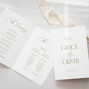 May include: A handmade wooden sign with the text "Welcome" in a handwritten style. The sign is painted white with a distressed finish, and a small green leaf is attached to the top. The sign measures approximately 12 inches wide.