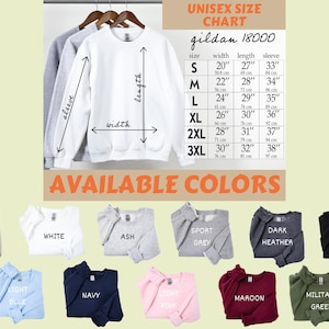 May include: White Gildan 18000 unisex sweatshirt with size chart and color options. The chart shows measurements in inches for width, length, and sleeve. Available colors include sand, white, ash, sport grey, dark heather, black, light blue, navy, light pink, maroon, and military green.