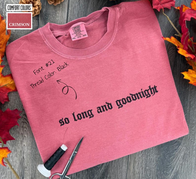 A pink comfort colors t-shirt with the text "so long and goodnight" embroidered on it,