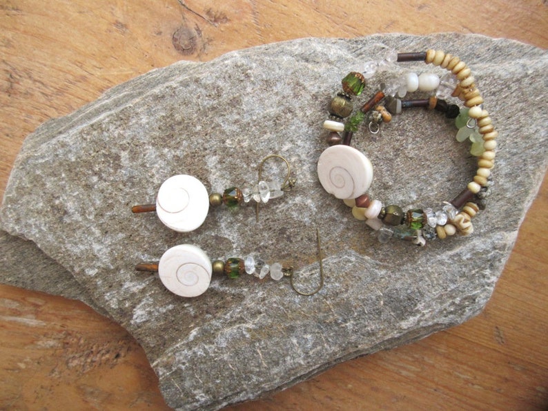 A nature adornment memory bracelet and earrings with pearls eye of St Rhythms Of The Oceans.... Lucia