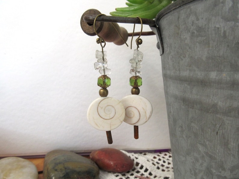 A nature adornment memory bracelet and earrings with pearls eye of St Rhythms Of The Oceans.... Lucia