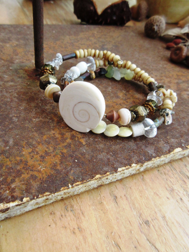 A nature adornment memory bracelet and earrings with pearls eye of St Rhythms Of The Oceans.... Lucia