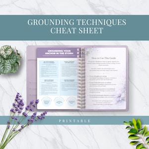 May include: A lilac notebook with the text "Grounding Techniques Cheat Sheet" and "Grounding: Your Anchor in the Storm." The notebook is open, displaying grounding techniques and instructions. The word "Printable" is at the bottom.