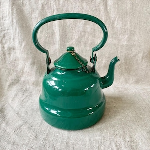 May include: A rustic wooden sign with the text "Welcome to our home" in white lettering. The sign features a distressed finish and a simple, inviting design, perfect for front door decor.