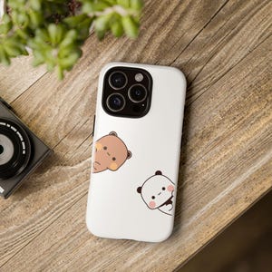 丈夫なケース、かわいいドゥドゥベアの電話ケース、楽しい保護カバー、耐久性のあるスマートフォンスリーブ、愛らしい漫画キャラクター、頑丈なモバイルシェル