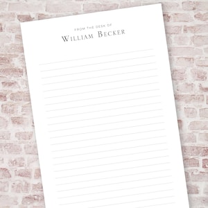 May include: White lined notepad with the text "From the desk of William Becker" at the top.