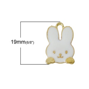 May include: Gold-tone charm featuring a white enamel bunny with a cute face. The charm is approximately 19mm (6/8 inches) in size.