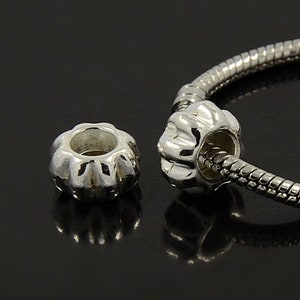 European style large hole silver or gold alloy beads. Pack of 5 or 10 beads. Fit 3 to 5 mm Euro style snake chain, cord or leather