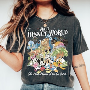 May include: A set of three ceramic mugs with a speckled, matte finish. The mugs are in shades of cream, light gray, and dark gray. Each mug has a simple, minimalist design and a rounded handle.