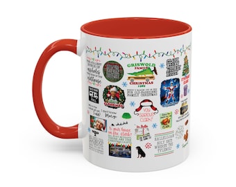 May include: A white ceramic mug with a bright red handle and interior rim, featuring a collage of colorful Christmas-themed graphics and quotes from the movie National Lampoon's Christmas Vacation, including images of a station wagon and a tree.