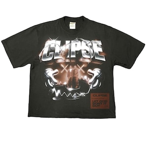May include: Black t-shirt with a graphic design featuring the word "CLIPS" in a chrome-like font. The design includes a stylized image and the text "LET GOD SORT IT OUT" in a red box. A vintage-style tee.