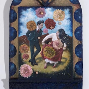 May include: A framed painting depicts a couple dancing amidst floating flowers. The artwork features a dark-suited man and a woman in a red skirt. The frame is dark blue with gold accents and a hand with an eye in the center.
