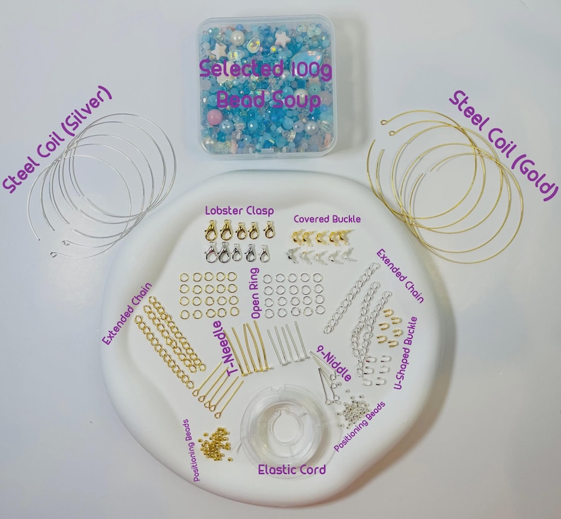 May include: A jewelry-making kit with various components. Includes a container of blue and white beads, silver and gold steel coils, clasps, open rings, extended chains, T-needles, and elastic cord. The kit is arranged on a white, oval-shaped tray.