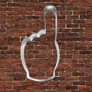 May include: A silver metal cookie cutter shaped like a raised index finger.