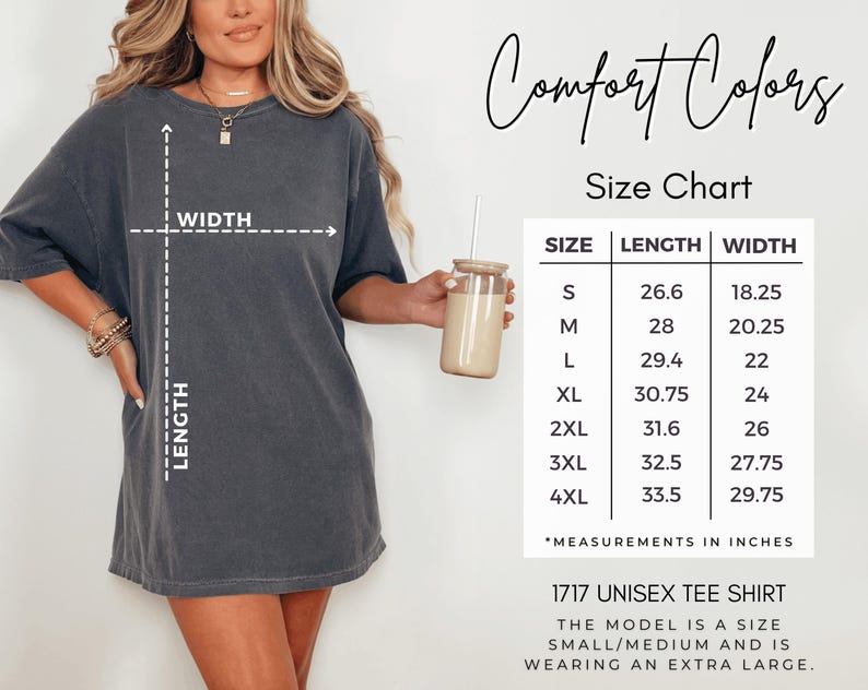a woman wearing a grey t-shirt with measurements and a size chart for the t-shirt, along with a drink in a glass.