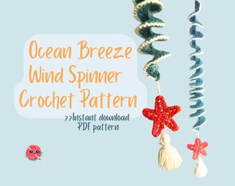 May include: A crochet pattern for an Ocean Breeze Wind Spinner. The image shows two spiral wind spinners, one in teal and white, the other in blue and white. Each has a red starfish and a white tassel. The text reads "Ocean Breeze Wind Spinner Crochet Pattern".