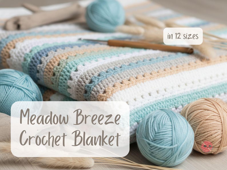 May include: A handmade crochet blanket in shades of white, blue, and tan, with the text "Meadow Breeze Crochet Blanket" and "in 12 sizes". The blanket is surrounded by balls of yarn and a crochet hook.