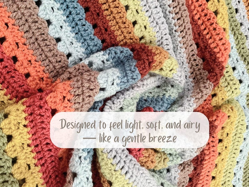 May include: A colorful, handmade crochet blanket with a variety of warm tones, including orange, brown, and yellow. The blanket has a textured appearance and is designed to feel light, soft, and airy.