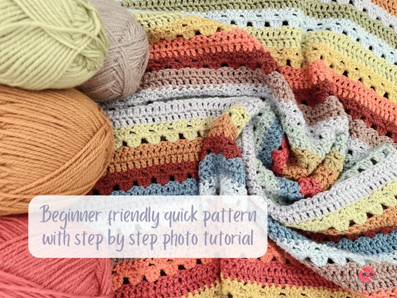 May include: A colorful, handmade crochet blanket with a striped pattern in shades of orange, yellow, gray, and blue. Several balls of yarn in complementary colors are arranged nearby. The text "Beginner friendly quick pattern with step by step photo tutorial" is visible.