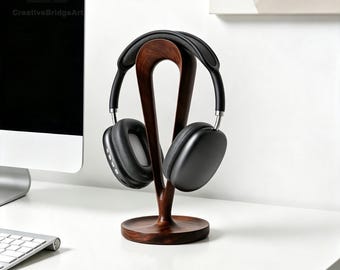 Soporte para auriculares de madera maciza hueca, minimalista y curvado, ideal para gamers y amantes del audio.